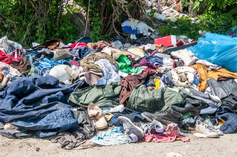 credential clothing in a landfill
