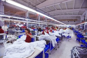 workers assemble clothing in a factory