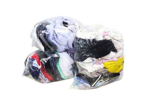 sealed bags of donated used clothing