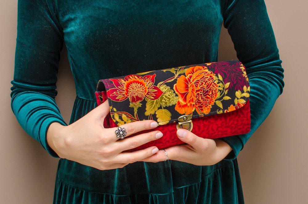 woman holding a used vintage handbag