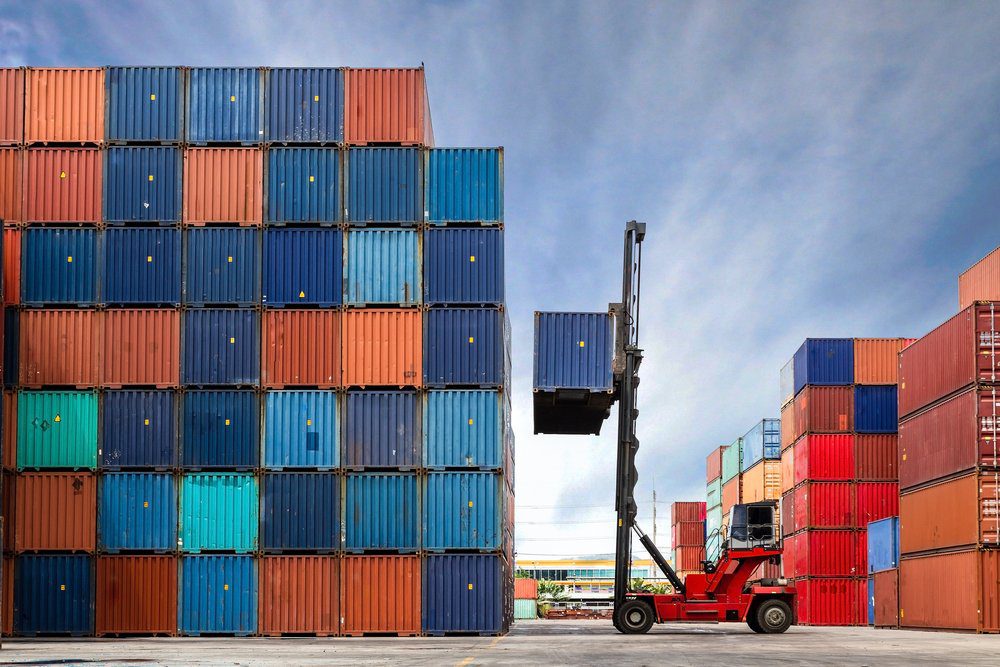 shipping containers being unloaded