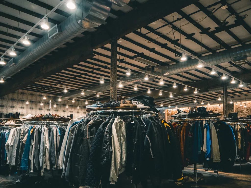 A thrift shop filled with clothes, shoes, and miscellaneous items