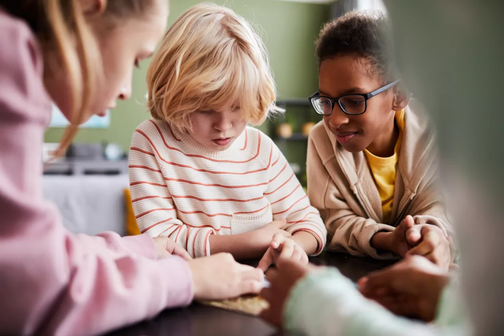 A group of kids working together on arts and crafts