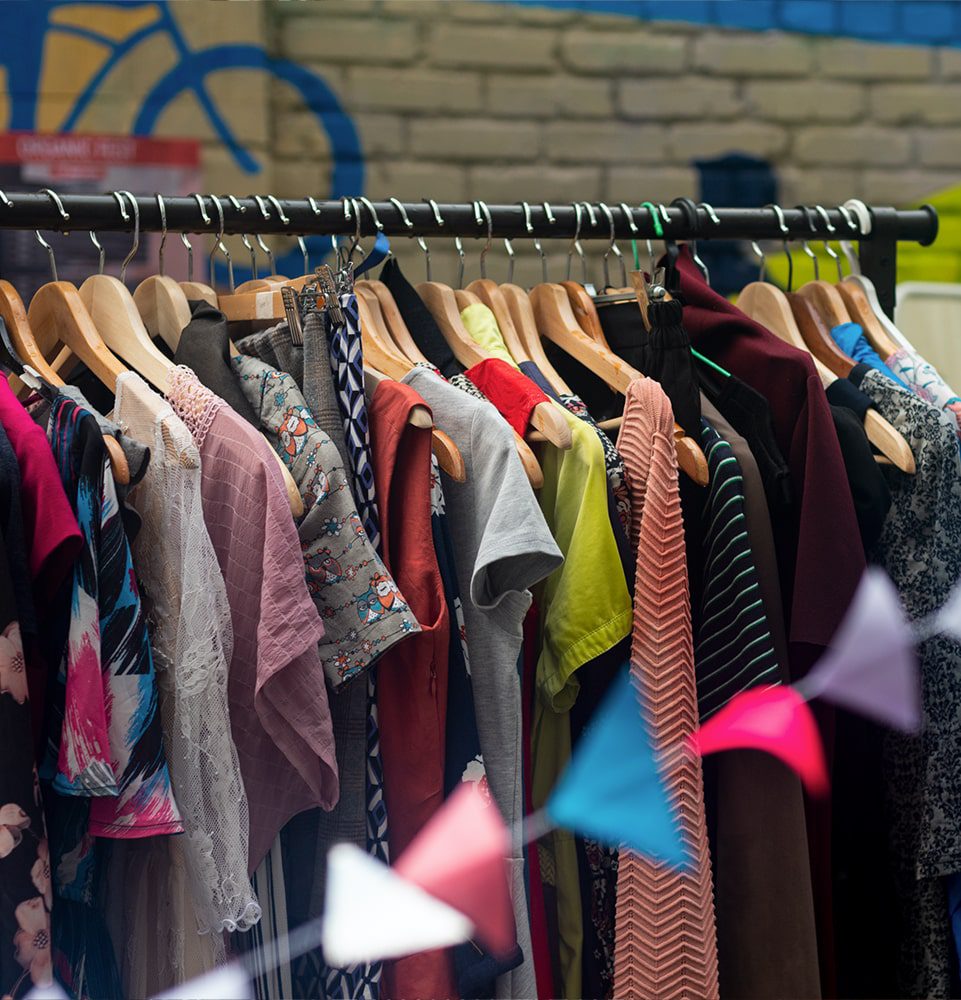 A rack of vintage shirts and dresses