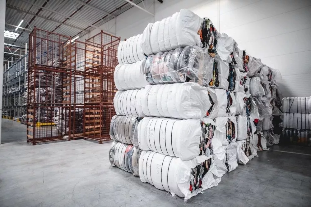 A bale of clothing in a warehouse