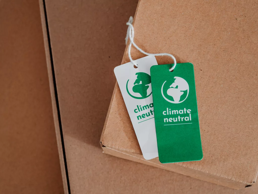 This image depicts Eco-friendly packing with labels that say "climate neutral" 